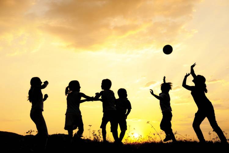 A family playing volleyball at Roberts Point Park