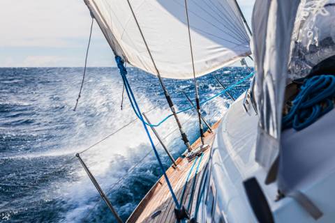 A sail boat participating in a regatta A sail boat participating in a regatta